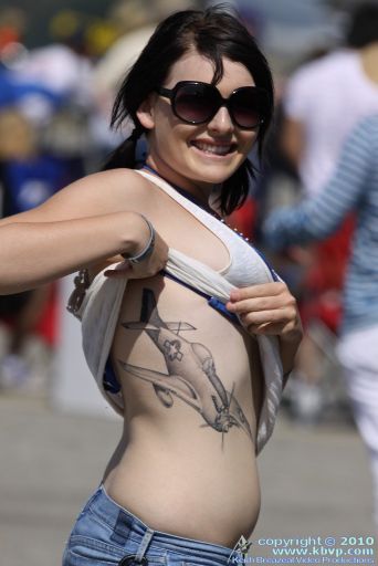 Girl Shows Off Her P-51 Mustang Tattoo.preview
